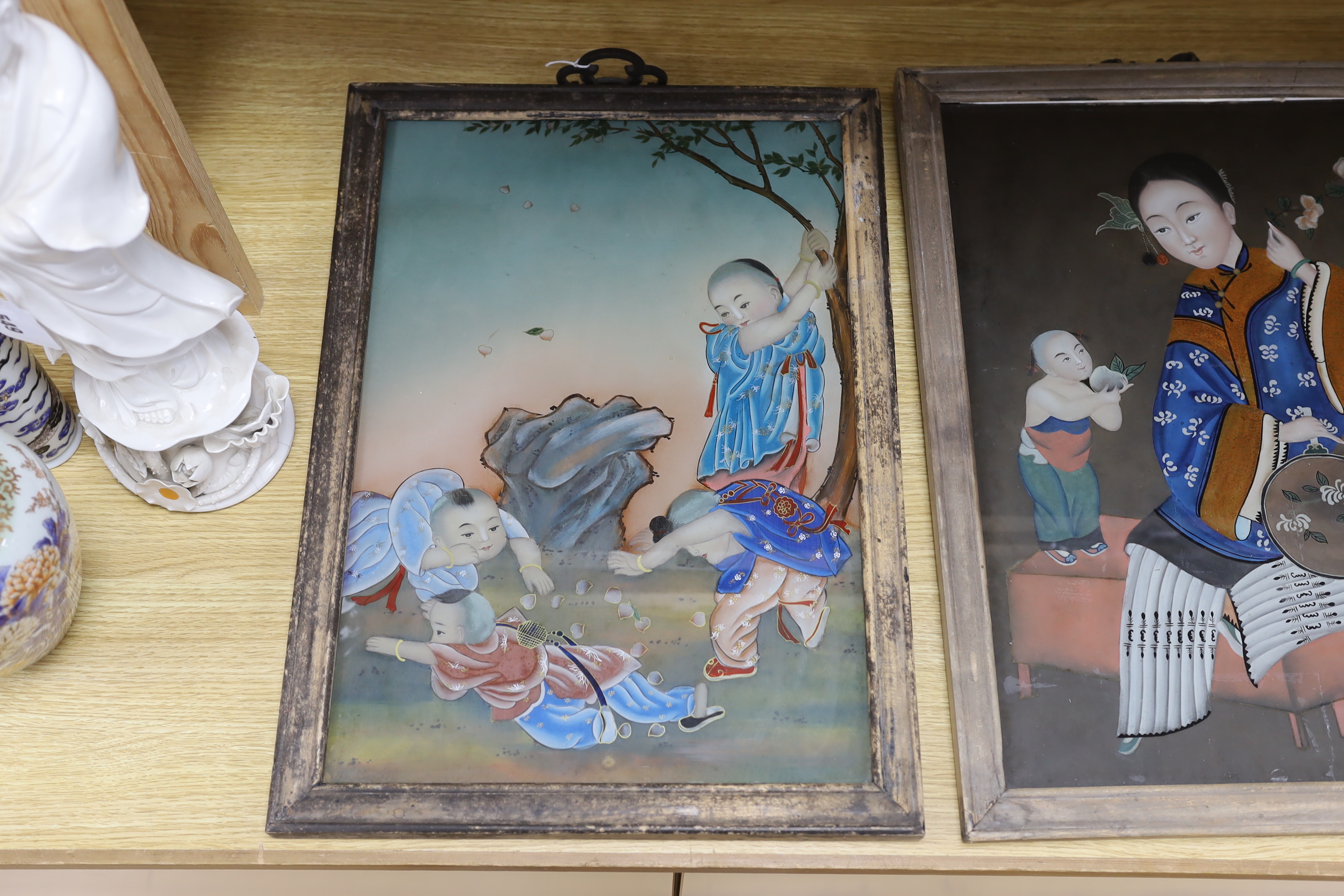 Two Chinese 20th century figural reverse painted glass pictures, framed largest 33cm wide x 49cm